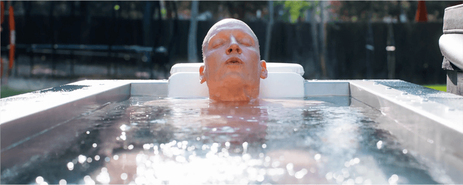 JP Crimini Breathwork Coach Cold Plunging in a BlueCube in his backyard