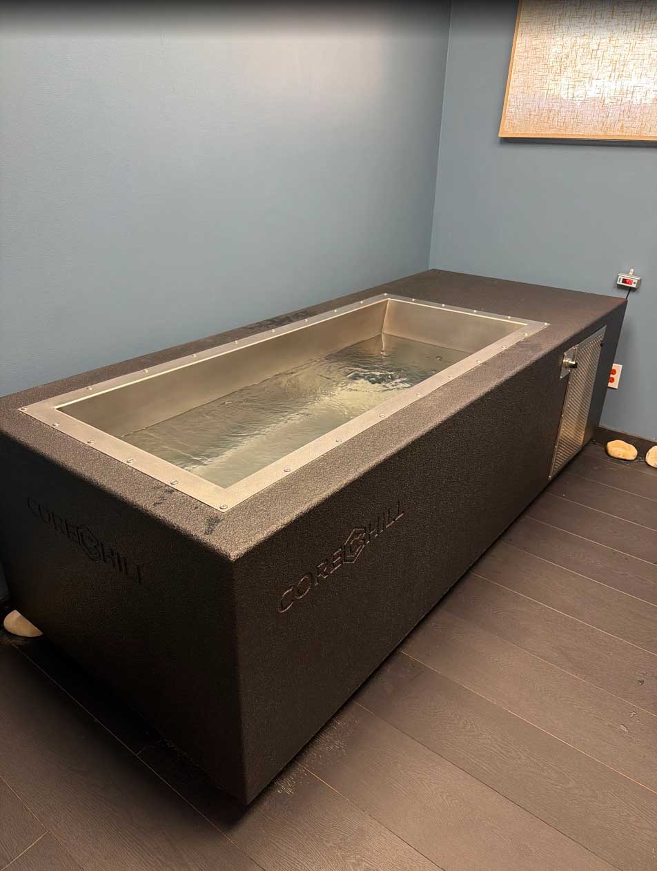 BlueCube C2 black cold plunge installed in the recovery room at The Stretch Garden in Riverhead, NY