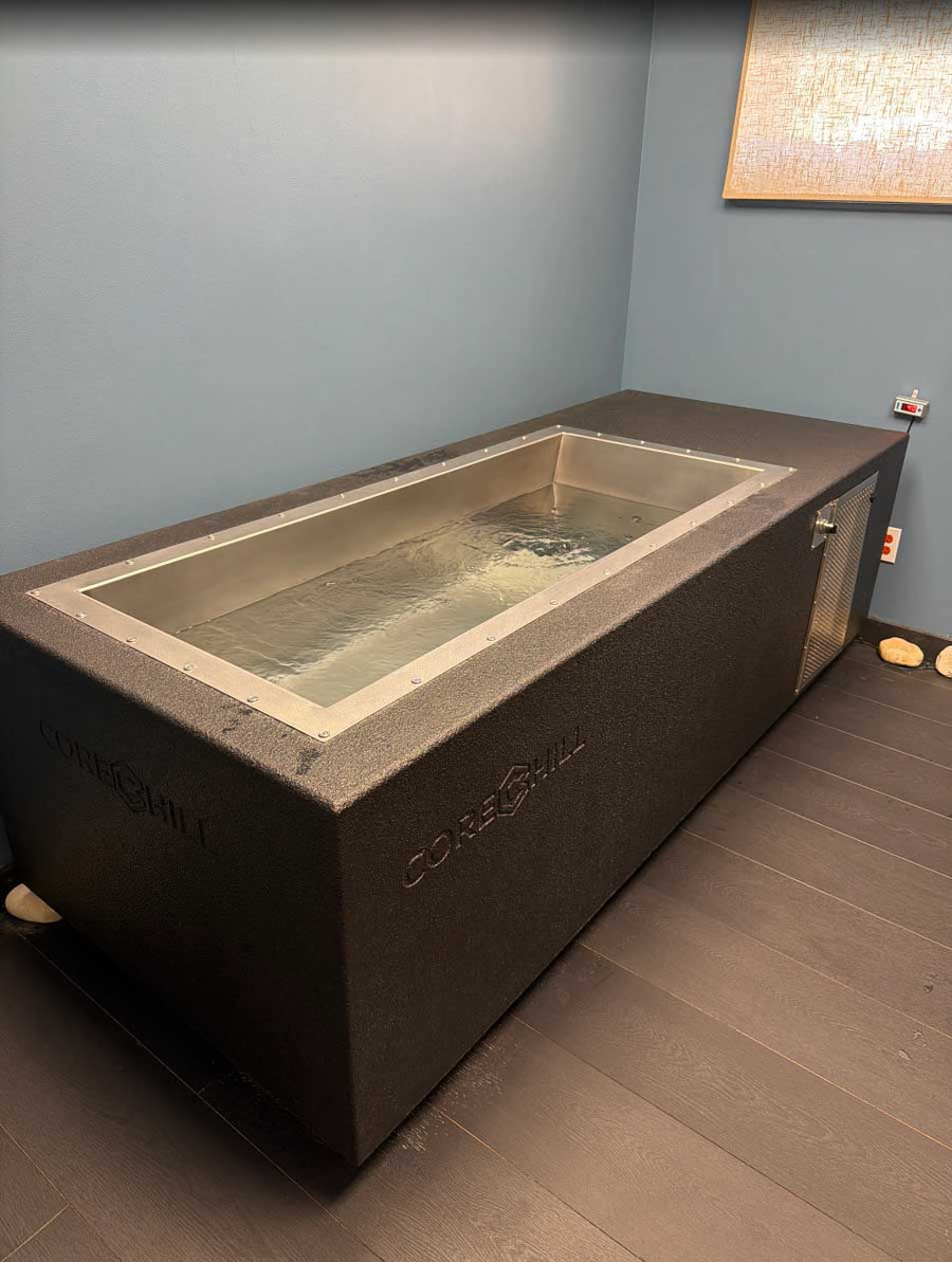 BlueCube C2 black cold plunge installed in the recovery room at The Stretch Garden in Riverhead, NY