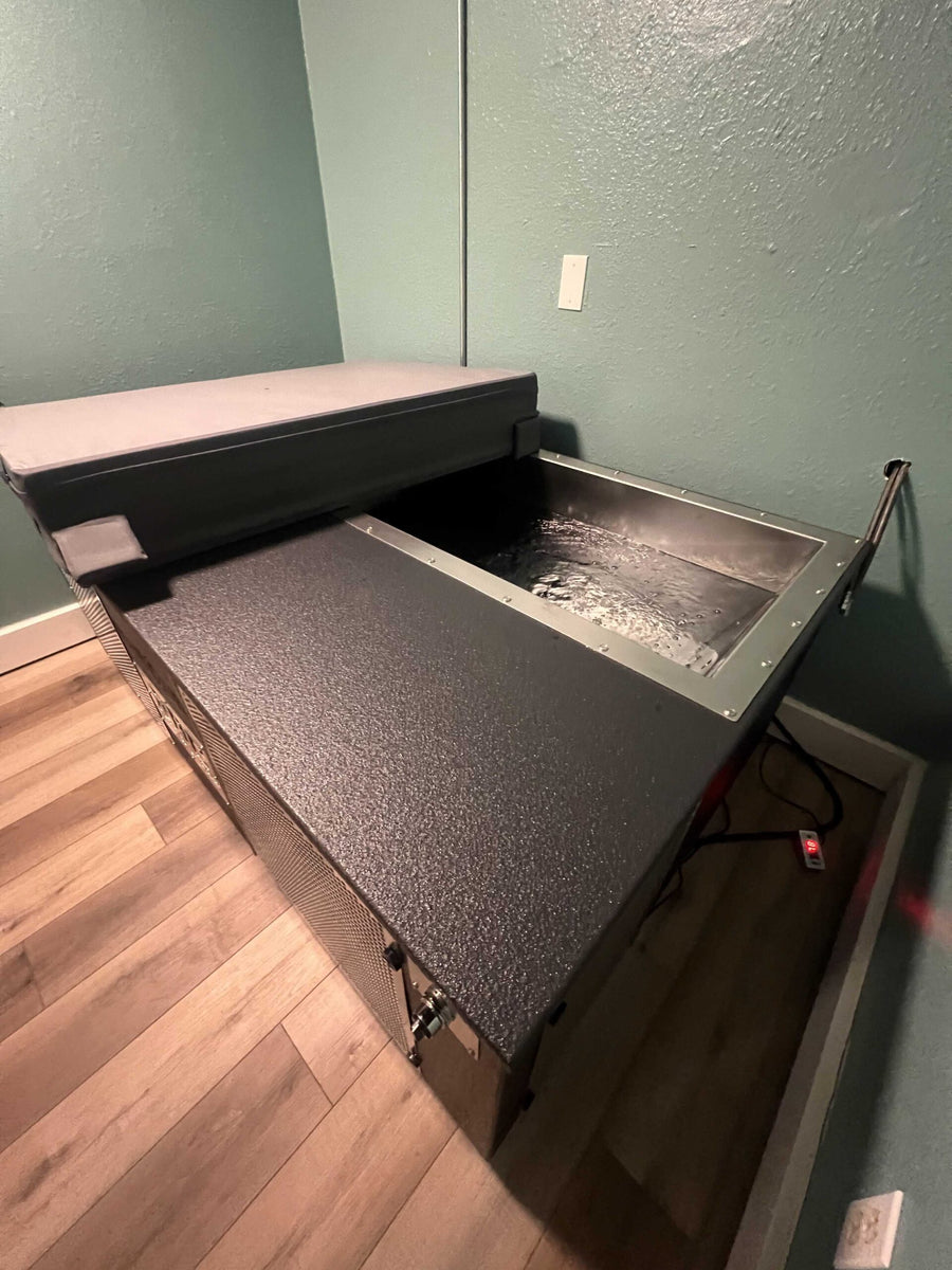 BlueCube C3 black cold plunge installed beside a private shower in the recovery room at Redmond Athletic Club