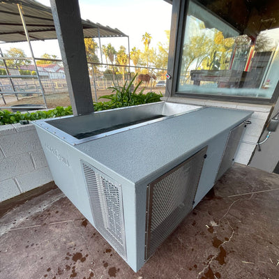 CoreChill Elite Cold Plunge Tub Grey placed outdoors on a farm top view
