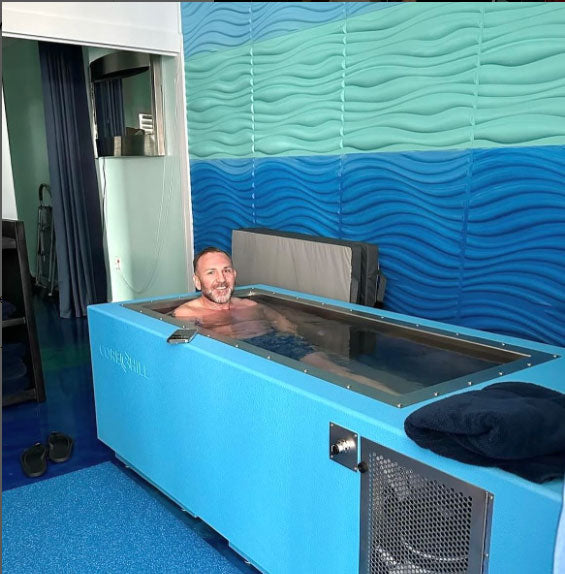 Man Using Light Blue Cold Water Immersion Tub