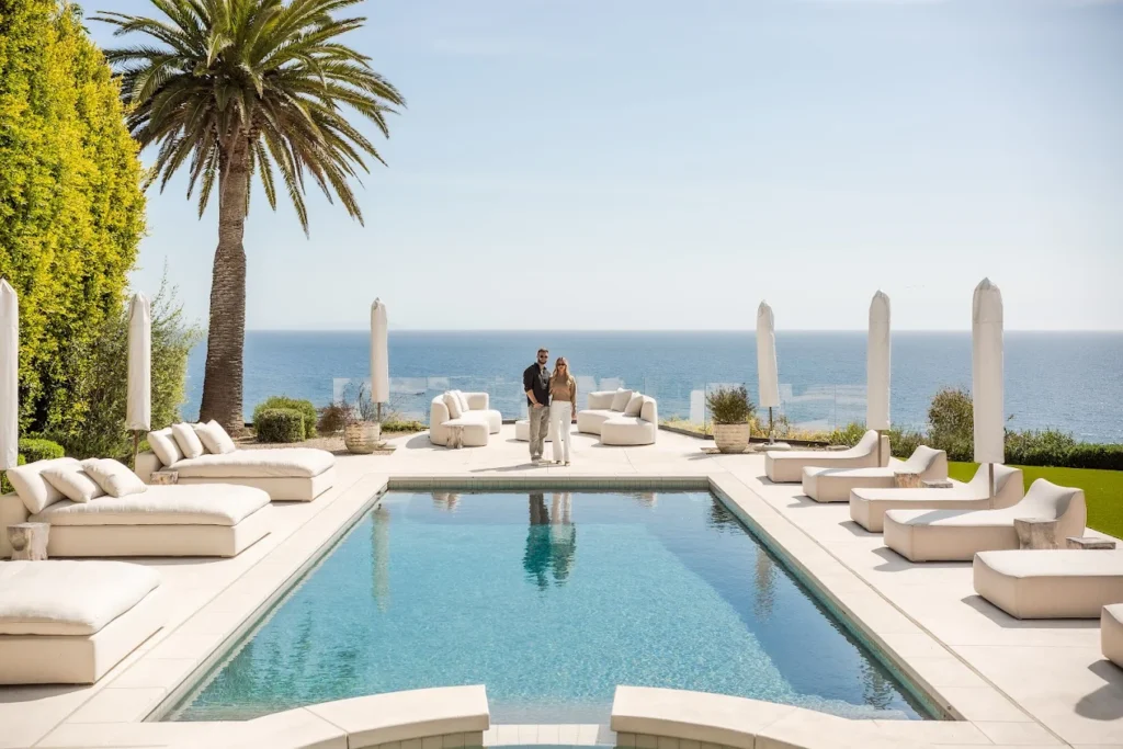 The Luxury home show icon two people standing by a luxury pool featuring bluecub cold plunge ice baths