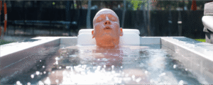 JP Crimini Breathwork Coach Cold Plunging in a BlueCube in his backyard