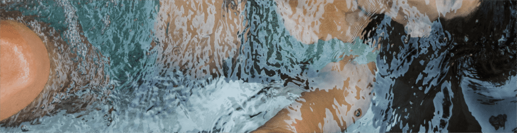 Woman submerged in a BlueCube Cold Plunge Ice Bath