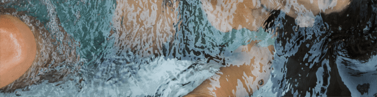 Woman submerged in a BlueCube Cold Plunge Ice Bath
