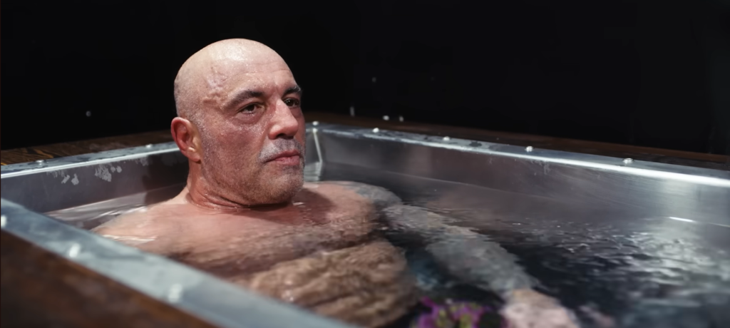 Joe Rogan in a stainless steel custom BlueCube Cold Plunge Ice Bath