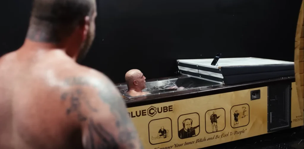 Joe Rogan in a wooden BlueCube Ice Bath Cold Plunge Tub at his podcast studio for The Joe Rogan Experience