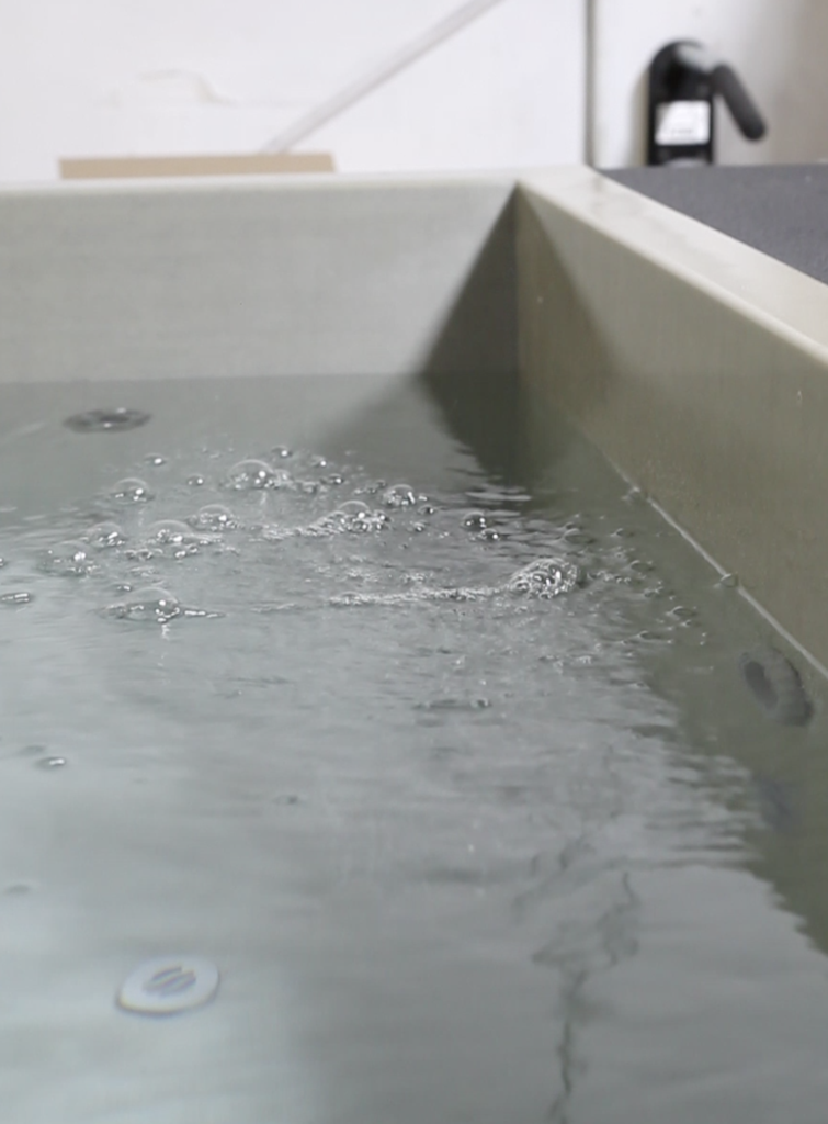 Hemp Carbon Tub with water by Common Fibers and BlueCube Cold Plunge